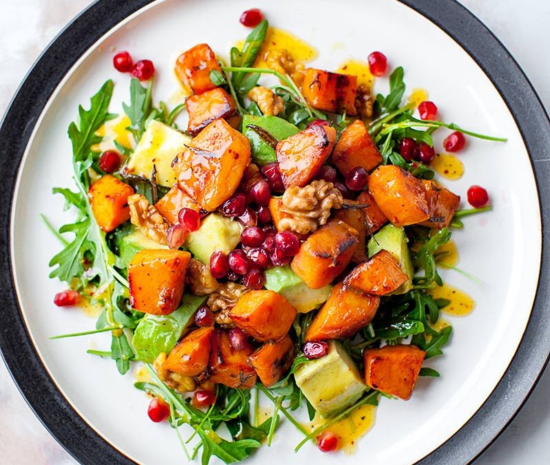 Avocado and roasted sweet potato salad with pomegranate and nuts